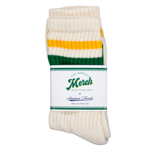 Load image into Gallery viewer, White sock with yellow and green stripes on a white background, featuring a label.
