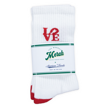 Load image into Gallery viewer, White sock with red and green text on a white background
