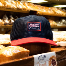 Load image into Gallery viewer, Navy and red cap with 'Reading Terminal Market' logo on a bread display.
